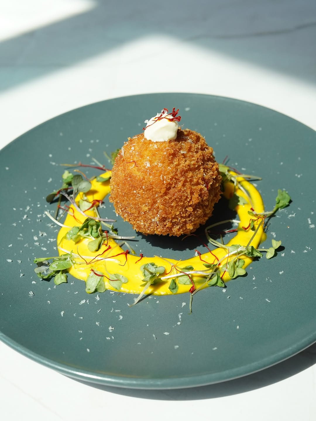 Duck arancini with seasonal herbs